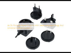 Adaptor daya portabel AC DC dengan colokan yang bisa diganti dan konektor optik universal